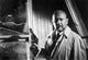 Donald Pleasence film still photo print carrying a pistol