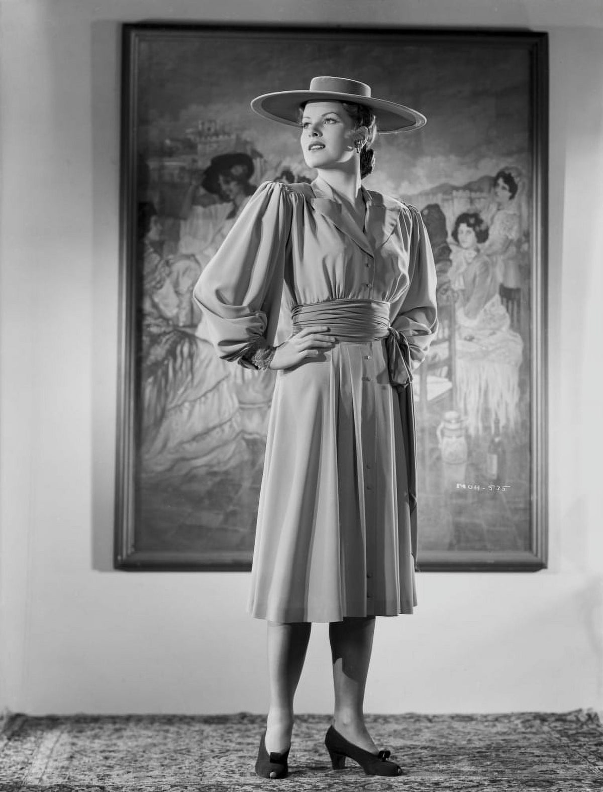 Maureen O'Hara standing in formal dress black and white photo print.