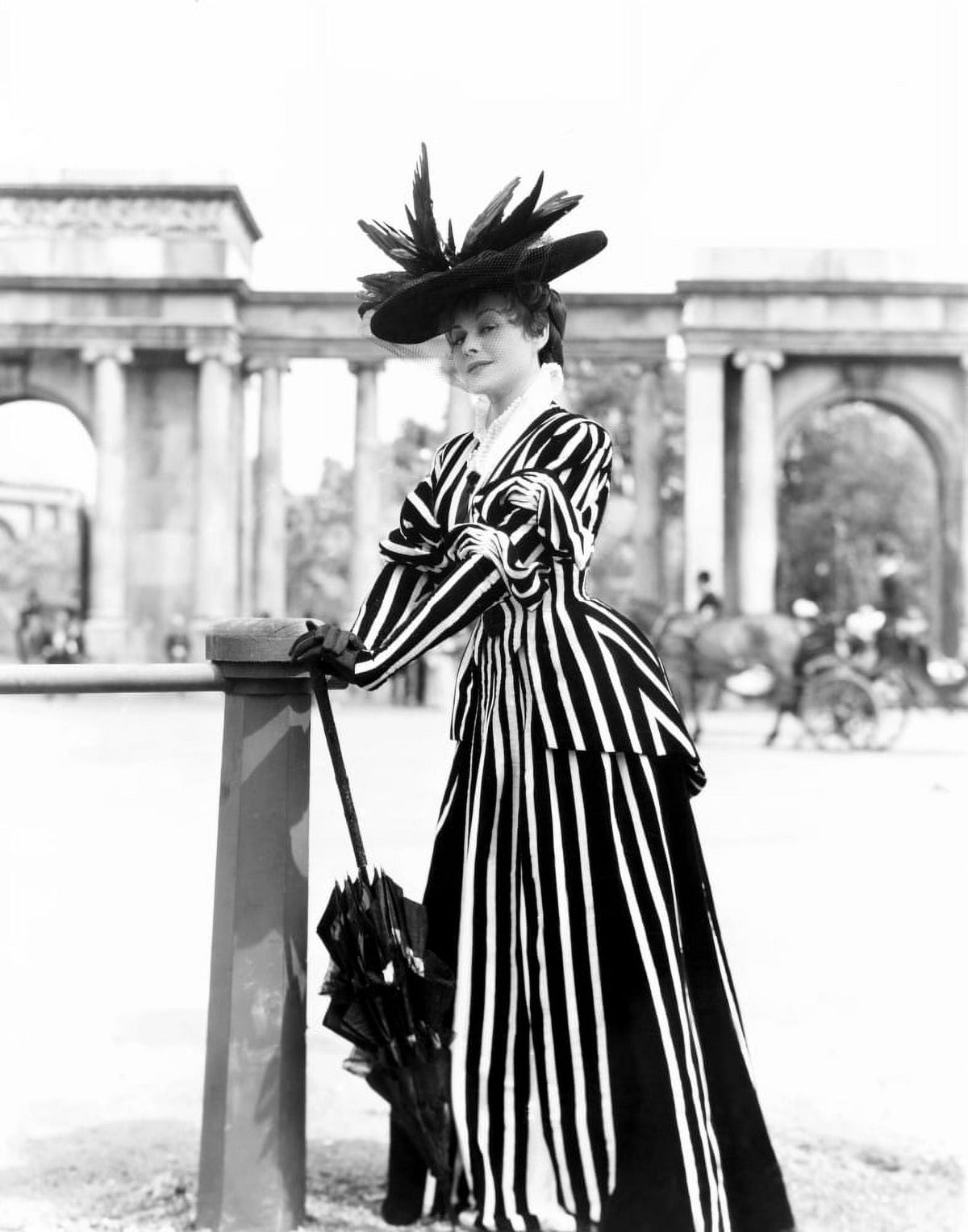 An Ideal Husband movie poster featuring Paulette Goddard in a gown by Cecil Beaton, classic film art.