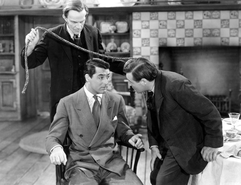 Arsenic and Old Lace movie poster featuring Cary Grant and Peter Lorre, Attacking from Behind scene.