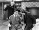 Arsenic and Old Lace movie poster featuring Cary Grant and Peter Lorre, Attacking from Behind scene.