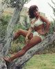 Senta Berger posed in white bikini on a tree photo print.