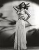 Dolores Del Rio posed in a floral dress, vintage photo print