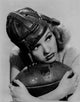 Betty Grable posed with a football photo print