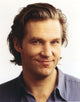 Close-up portrait photo print of Jeff Bridges in grey collar shirt.