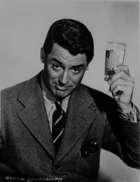 Cary Grant photo print in suit with drink in hand, vintage Hollywood charm.