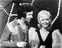 Tom Jones Photo Print showcasing captivating gaze at a woman.