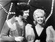 Tom Jones Photo Print showcasing captivating gaze at a woman.