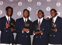Boyz II Men group portrait photo print holding trophies in black suits.