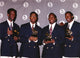 Boyz II Men group portrait photo print holding trophies in black suits.