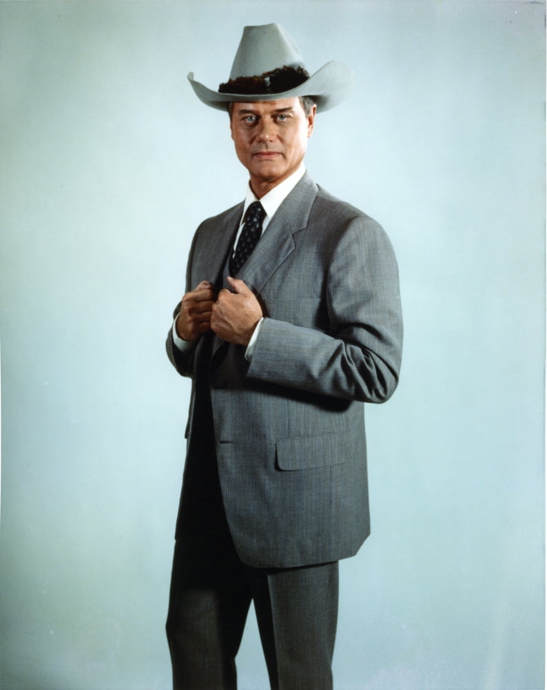 Larry Hagman posed in grey coat with cowboy hat photo print.