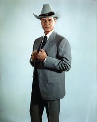Larry Hagman posed in grey coat with cowboy hat photo print.