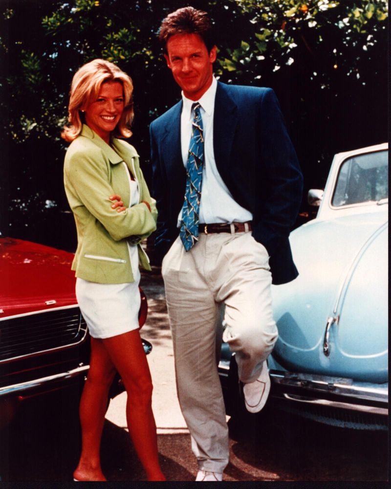 Janet Gunn and Chris Potter Silk Stalkings photo print featuring classic cars.