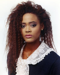 Elegant photo print of Robin Givens posed in a black dress.