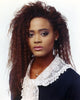 Elegant photo print of Robin Givens posed in a black dress.
