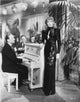 Marlene Dietrich standing elegantly in a black gown photo print.