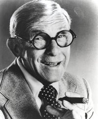 George Burns smoking a cigar photo print in classic black and white.