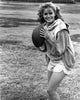 Classic photo print of Elizabeth Shue holding a football.