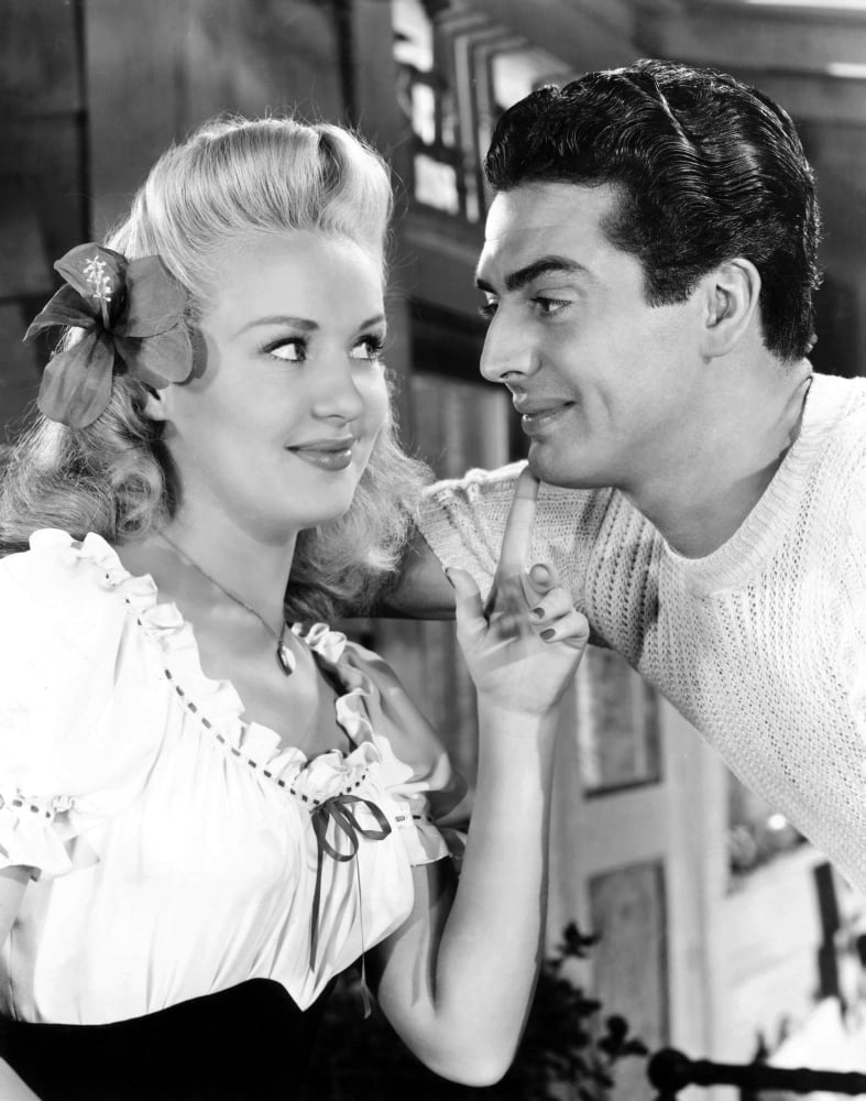 Song of The Islands movie poster print featuring Betty Grable and Victor Mature, 1942.