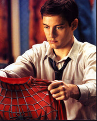 Tobey Maguire holding Spider-Man outfit photo print
