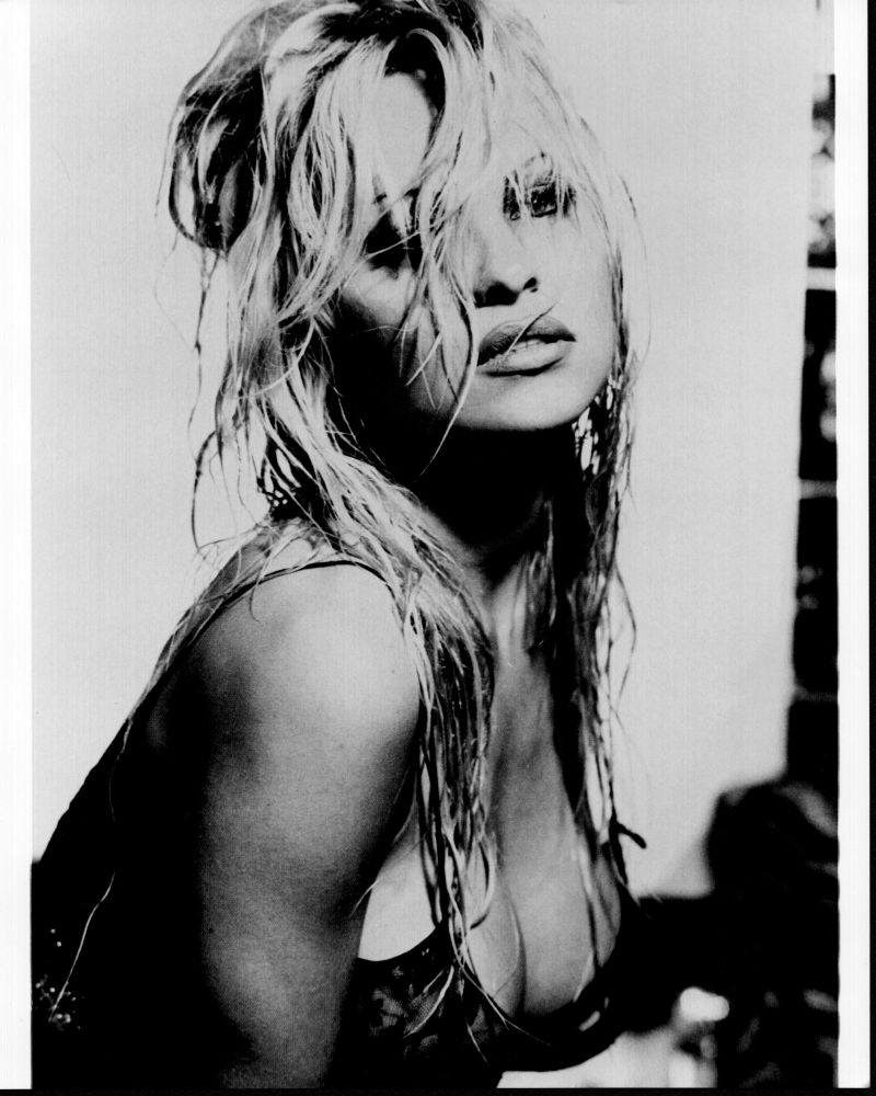 Pamela Anderson leaning forward with wet hair black and white photo print.