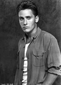 Emilio Estevez wearing a striped shirt photo print, available in multiple sizes.