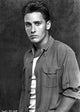 Emilio Estevez wearing a striped shirt photo print, available in multiple sizes.