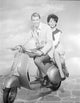 Photo print of a man and woman riding a scooter in Rome