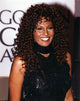Pam Grier smiling in a classic black dress photo print.