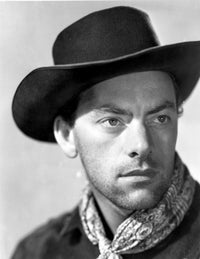 John Ireland posed in cowboy outfit photo print, available in multiple sizes.