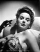 Marguerite Chapman Lying in Lingerie with Black Gloves Photo Print