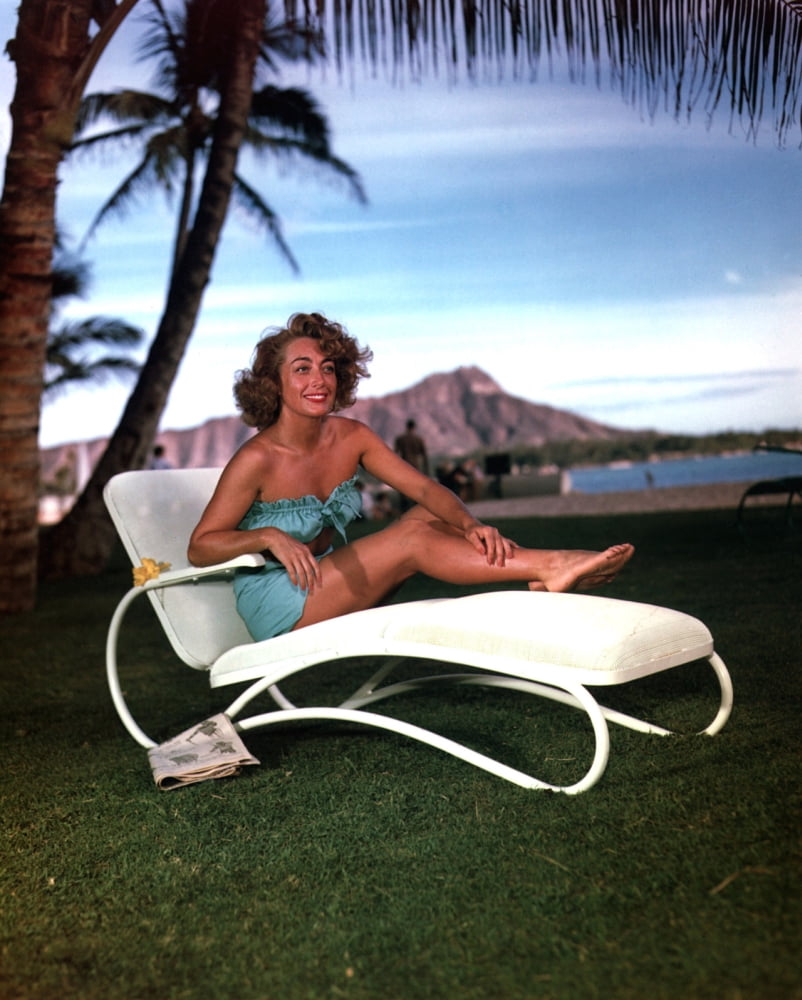 Joan Crawford lounging outdoors photo print, classic Hollywood style.
