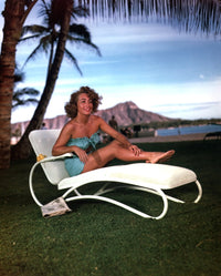 Joan Crawford lounging outdoors photo print, classic Hollywood style.