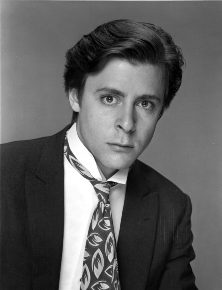 Judd Nelson photo print in a patterned tie, stylish 80s icon.