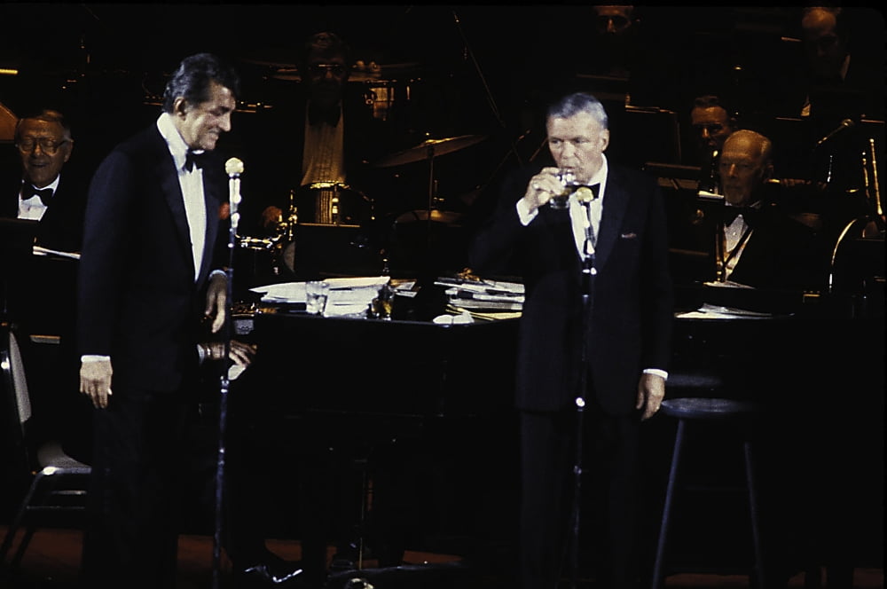 Frank Sinatra and Dean Martin performing photo print, capturing iconic entertainers.