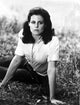Classic portrait photo print of Sigourney Weaver lying on the ground.