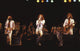 The Bee Gees live concert photo print capturing the trio on stage.