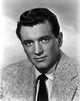 Rock Hudson posed in coat suit photo print with a white background.