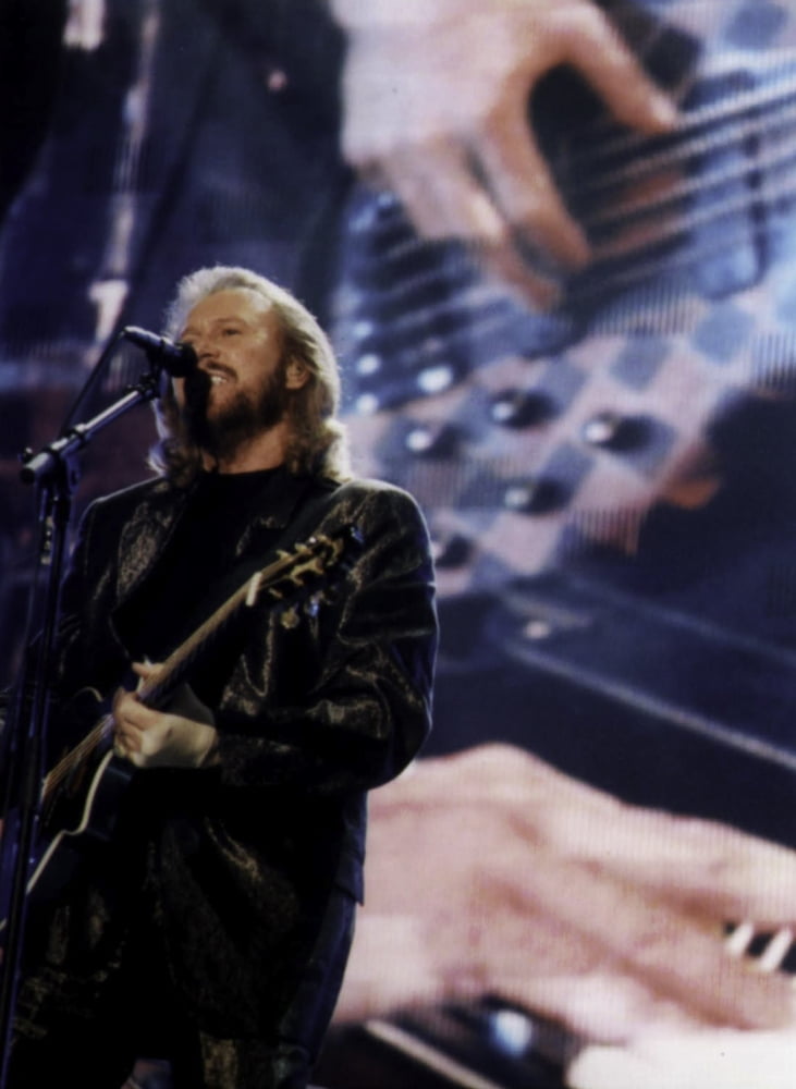 Barry Gibb performing live photo print, capturing the energy of his stage presence.