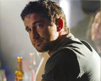 Candid photo print of Gerard Butler looking away, available in multiple sizes.