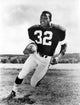 Jim Brown Photo Print showcasing an iconic football legend.