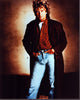 Rod Stewart photo print in a long brown coat with hands in pockets.