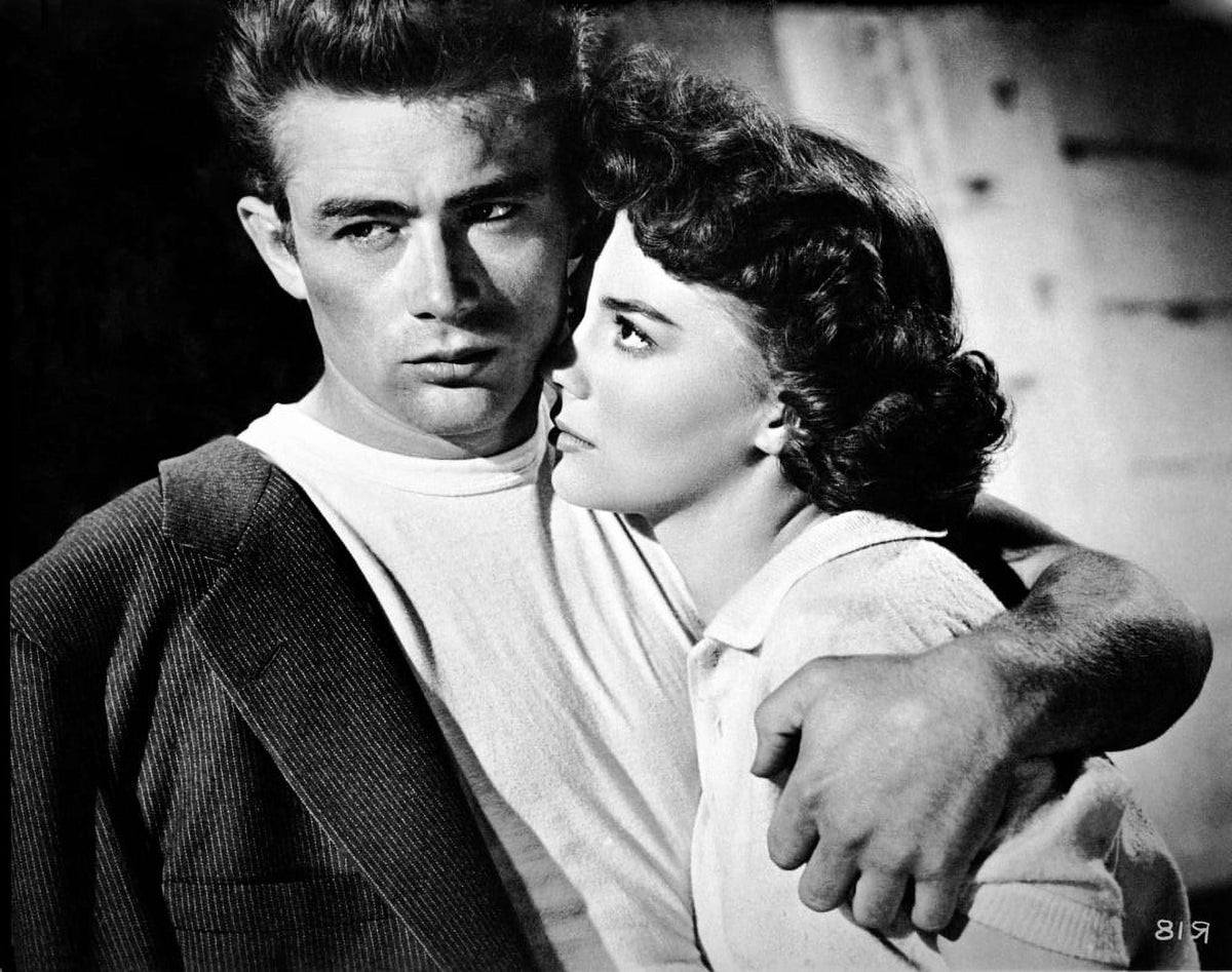 James Dean hugging a woman in a black suit photo print.