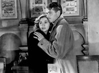 Rebecca movie poster print featuring Joan Fontaine and Laurence Olivier.