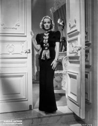 Marlene Dietrich standing in a black dress photo print
