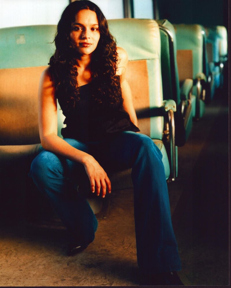 Norah Jones seated on a bus - Photo Print
