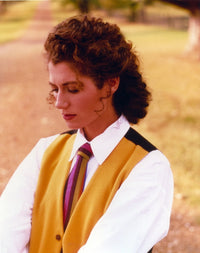 Amy Grant posed in a white long-sleeved outfit photo print.