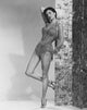 Cyd Charisse leaning on a folding wall - vintage photo print.