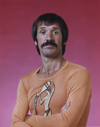 Sonny Bono posed in orange long sleeve shirt photo print