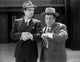 Abbott & Costello vintage photo print in suit and hat, capturing classic comedy.